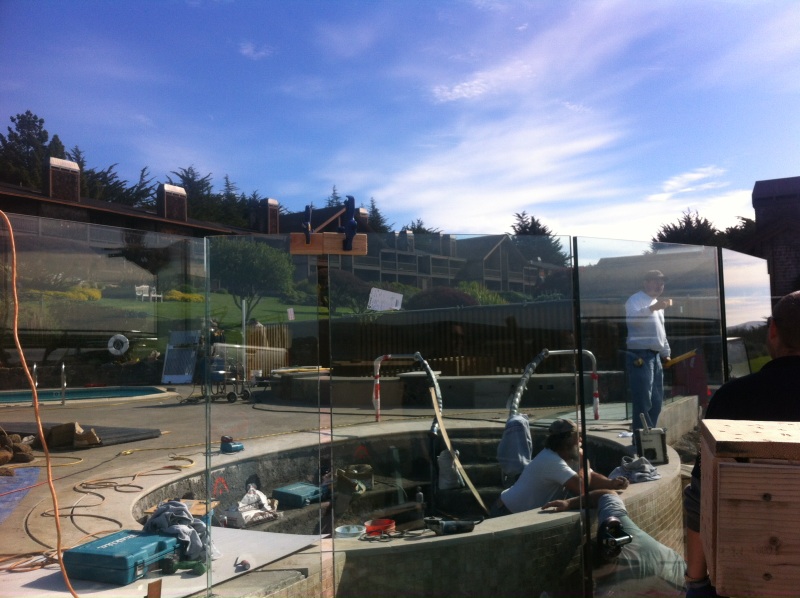 Installation of glass railing on pool deck by Old Town Glass